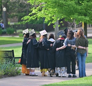 Graduates gather for a photo at Commencement.