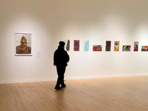 Student looking at artwork