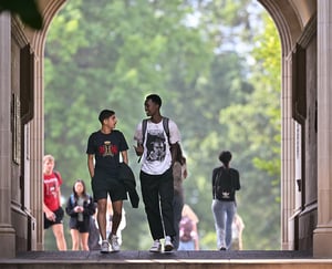 Students walking through Kauke Arch