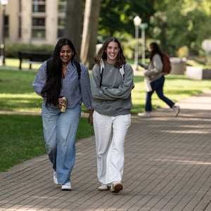 Students walking down sidewalk