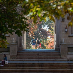 Students walking through Kauke Arch