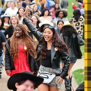 Student smiling and waving