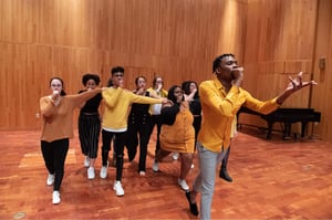 Students singing on stage