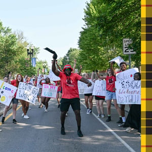 Students welcoming others during move-in on Beall Ave.