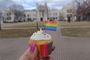 rainbow cupcake in front of Kauke
